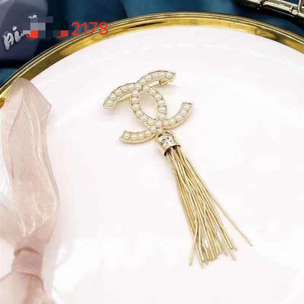 Studded letter tassel brooch product image 15, provided for visual reference and product detail review
